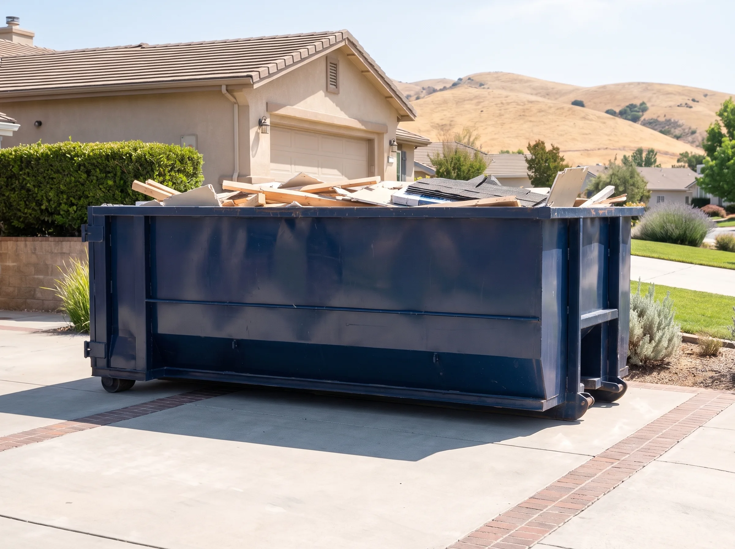 Roll-off dumpster being loaded in Los Angeles County, CA
